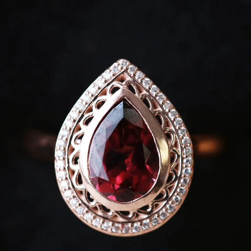 "PAYSLEE" - PEAR CUT GARNET ENGAGEMENT RING WITH DIAMOND HALO